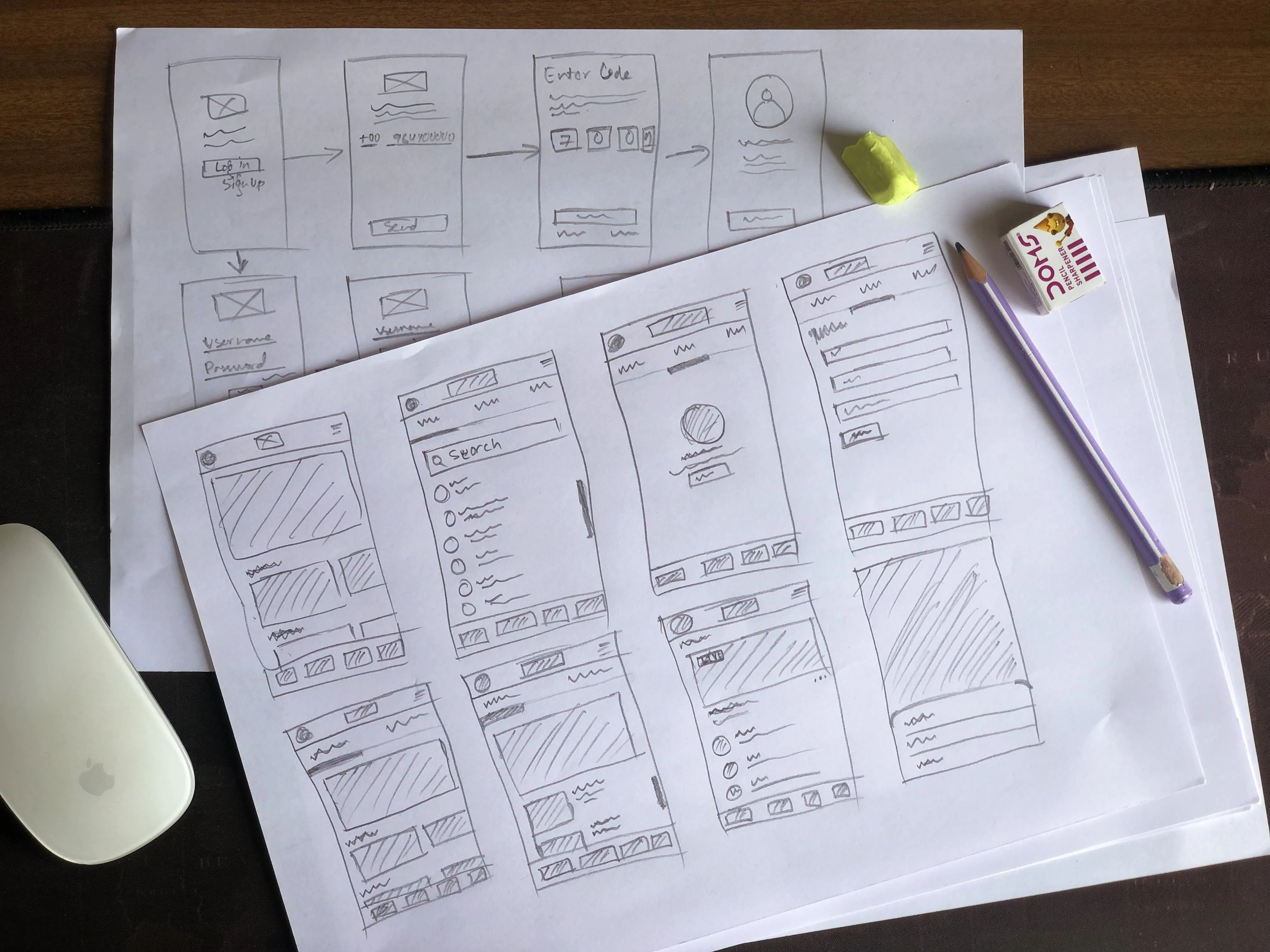 Hand-drawn paper wireframes sketching the sign-up, phone verification, and core app screens